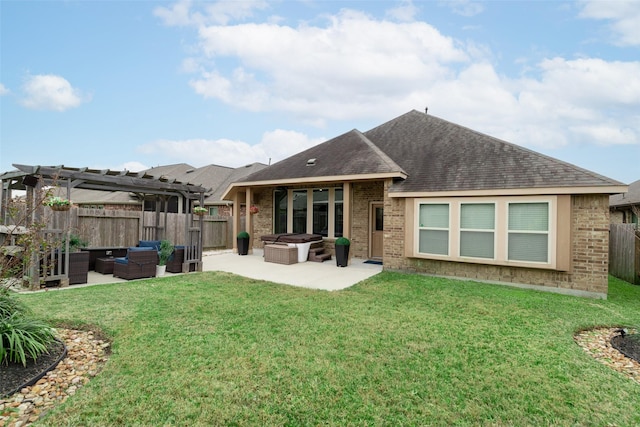 back of house featuring a patio, outdoor lounge area, a yard, and a pergola