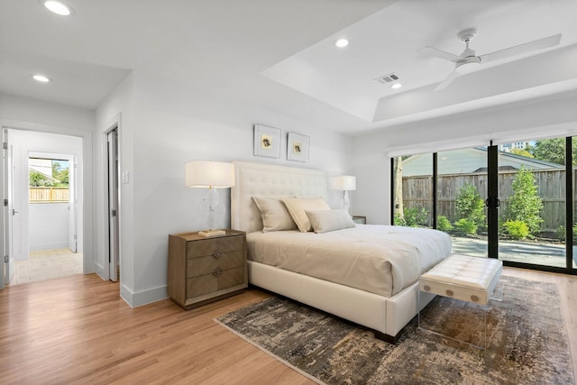 bedroom with ceiling fan, light hardwood / wood-style flooring, and access to outside