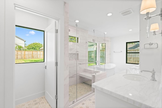 5658 Del Monte Dr, Houston, TX 77056 - bathroom featuring a stall shower, recessed lighting, vanity, and a soaking tub