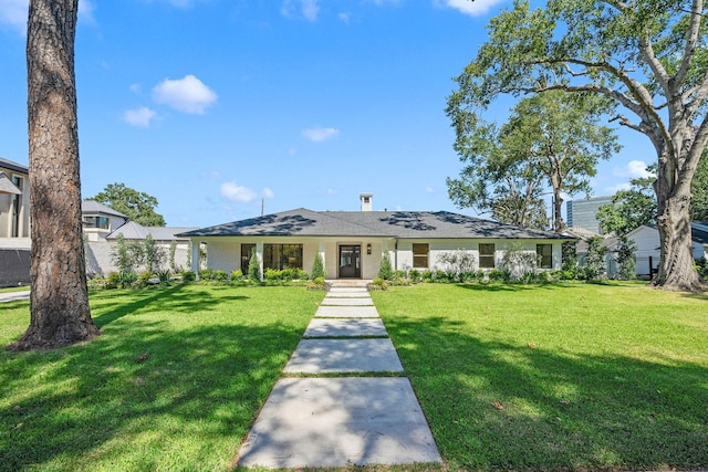 ranch-style home with a front lawn