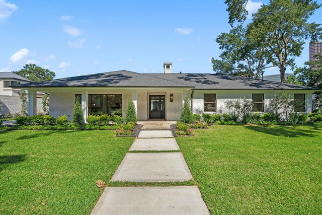 5658 Del Monte Dr, Houston, TX 77056 - view of front facade featuring brick siding and a front lawn