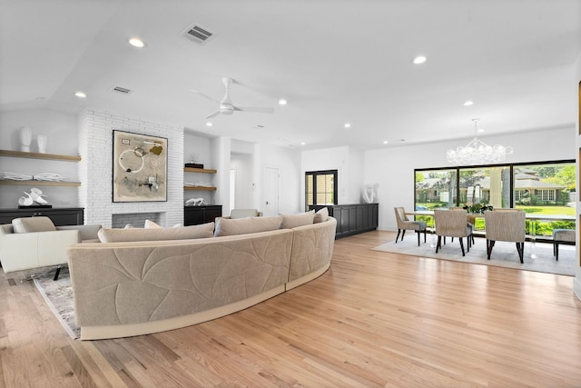 5658 Del Monte Dr, Houston, TX 77056 - living area featuring a chandelier, light wood finished floors, recessed lighting, a large fireplace, and a ceiling fan