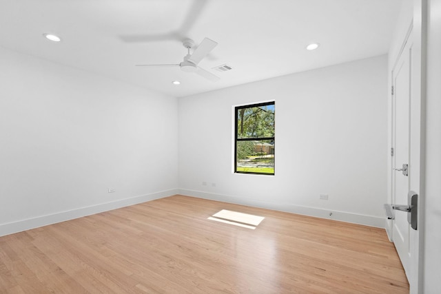 empty room featuring ceiling fan and light hardwood / wood-style flooring