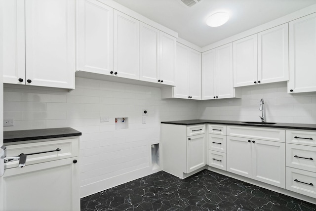 laundry area with sink, cabinets, hookup for a washing machine, and electric dryer hookup