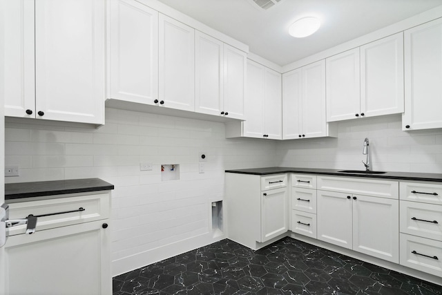 5658 Del Monte Dr, Houston, TX 77056 - laundry room with hookup for a washing machine, cabinet space, and electric dryer hookup
