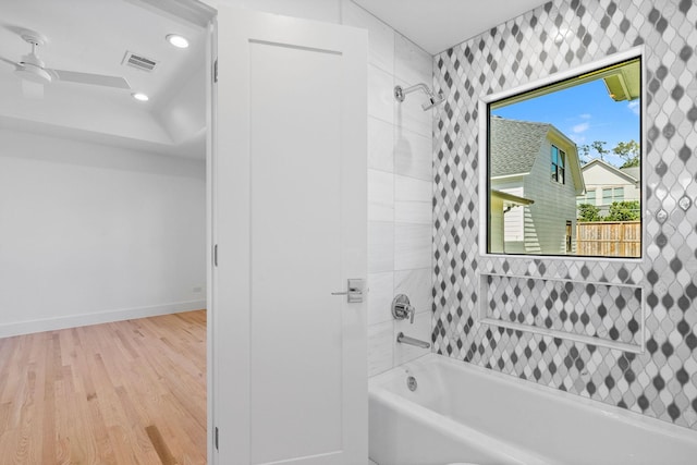 5658 Del Monte Dr, Houston, TX 77056 - bathroom featuring wood finished floors, washtub / shower combination, baseboards, ceiling fan, and recessed lighting