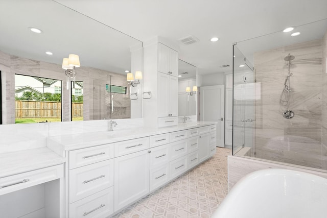 5658 Del Monte Dr, Houston, TX 77056 - bathroom featuring recessed lighting, a shower stall, double vanity, and a freestanding tub