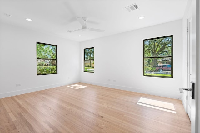 empty room featuring ceiling fan and light hardwood / wood-style flooring