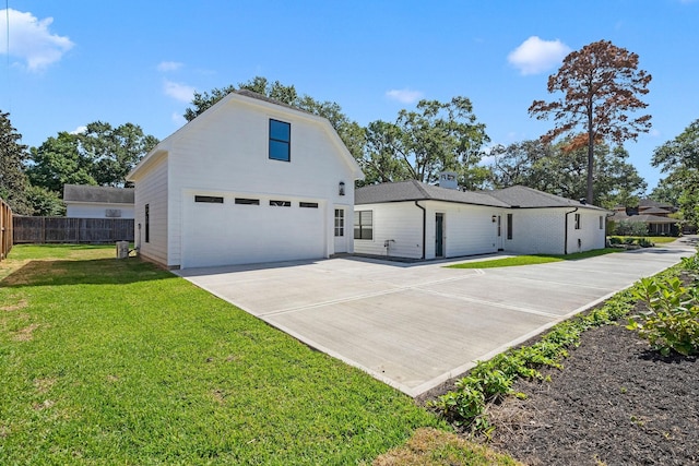 5658 Del Monte Dr, Houston, TX 77056 - view of front of property with concrete driveway, a garage, and an outdoor structure