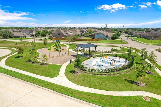 view of home's community with a playground, a gazebo, and a yard