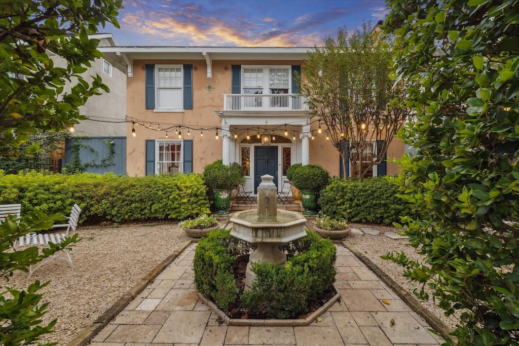 view of front of home with a balcony