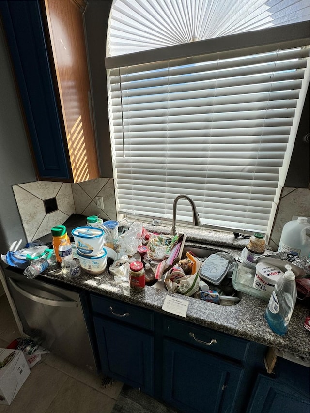 interior space with vanity, tile patterned flooring, and backsplash