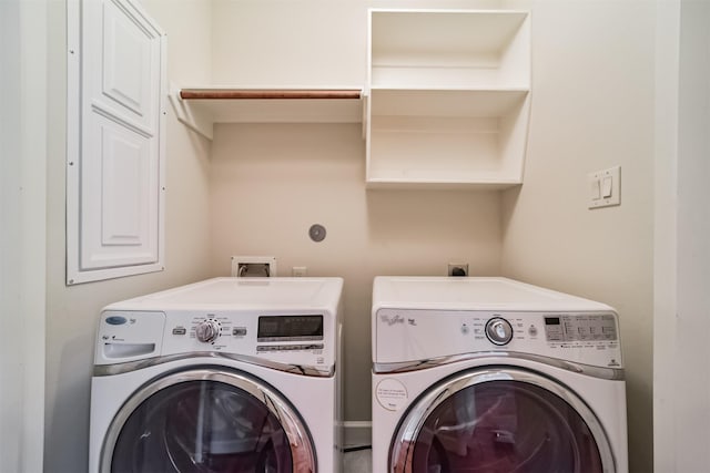 washroom with washer and dryer