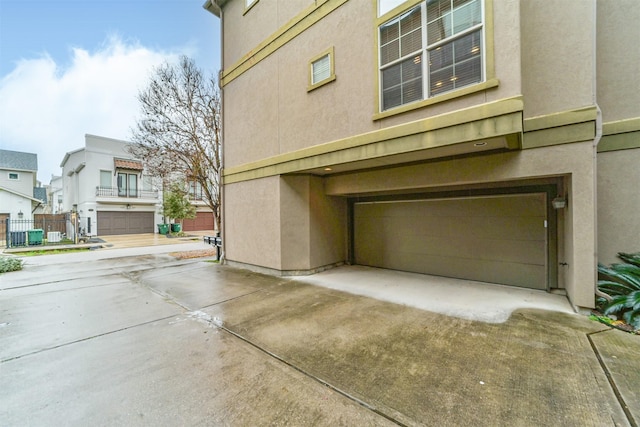 view of property exterior with a garage