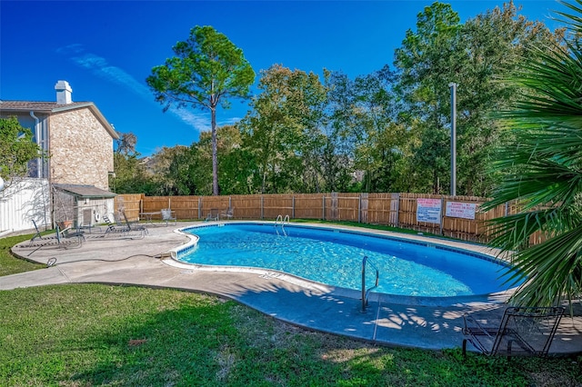 view of swimming pool featuring a patio area