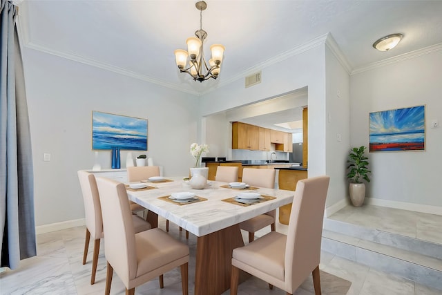 dining space featuring sink, a chandelier, and ornamental molding