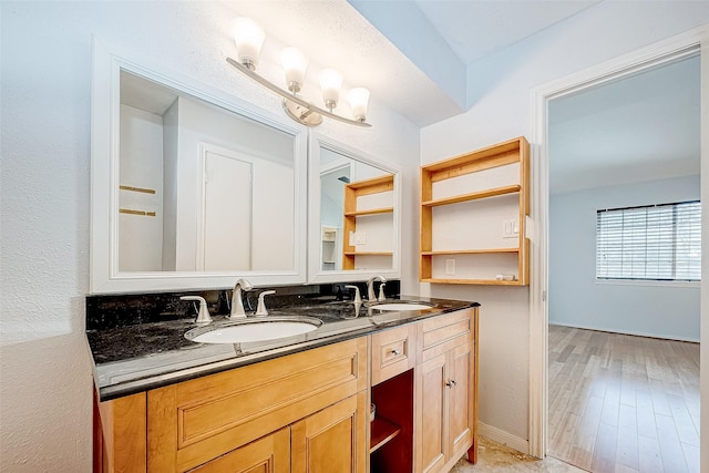 bathroom with hardwood / wood-style floors and vanity