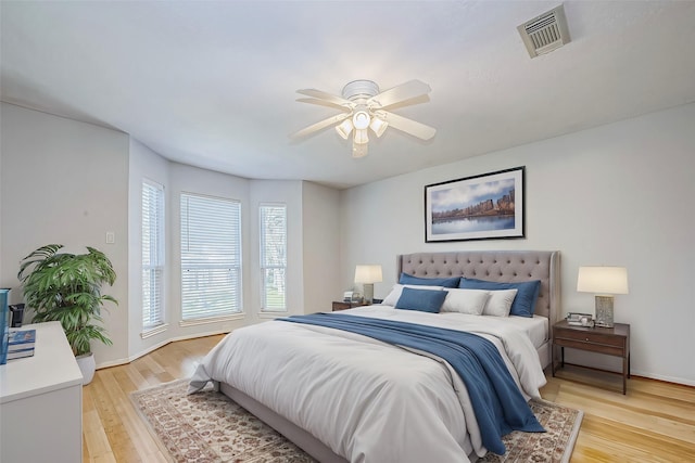 bedroom featuring ceiling fan and light hardwood / wood-style flooring