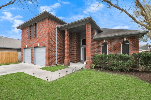 split level home with a front yard and a garage