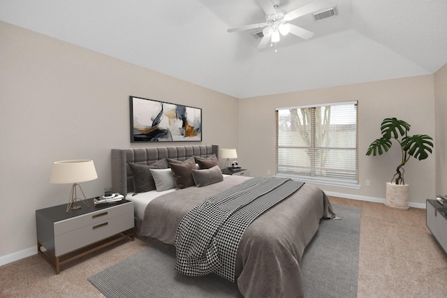 carpeted bedroom with ceiling fan and lofted ceiling