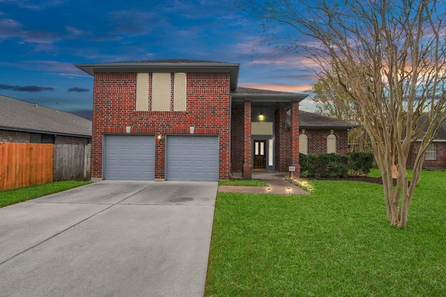 split level home with a garage and a lawn