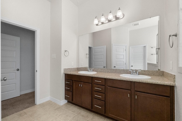 bathroom with vanity and tile patterned floors