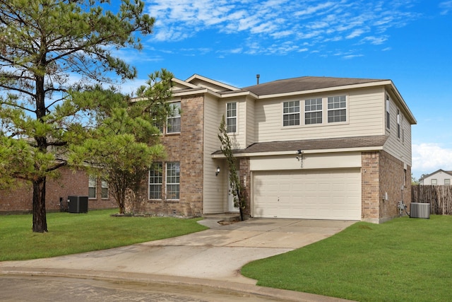 view of front of house featuring a front lawn, a garage, and central air condition unit