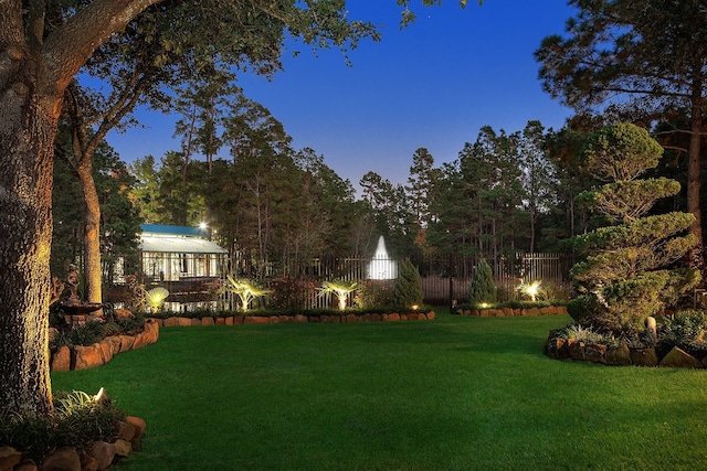 view of yard at dusk