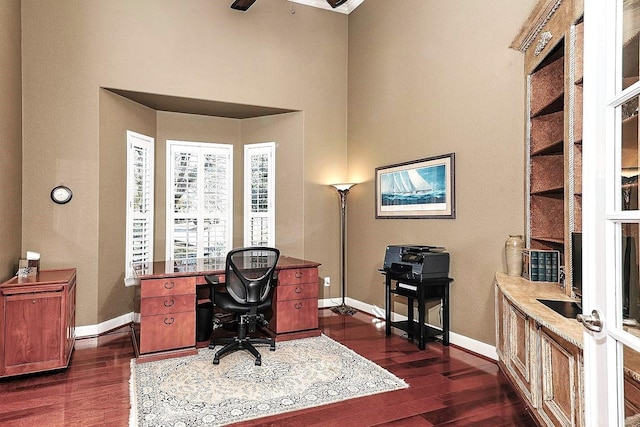 office space with dark hardwood / wood-style flooring