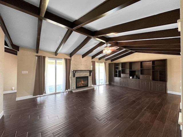 unfurnished living room with ceiling fan, lofted ceiling with beams, and a stone fireplace