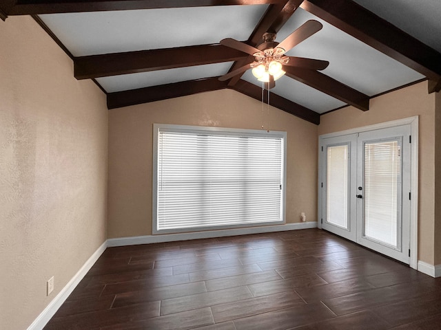 empty room featuring ceiling fan, french doors, and vaulted ceiling with beams