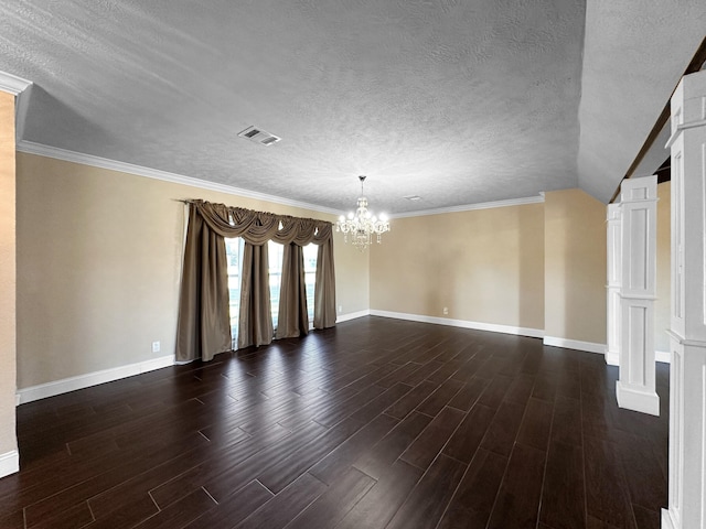 spare room with lofted ceiling, crown molding, an inviting chandelier, and a textured ceiling