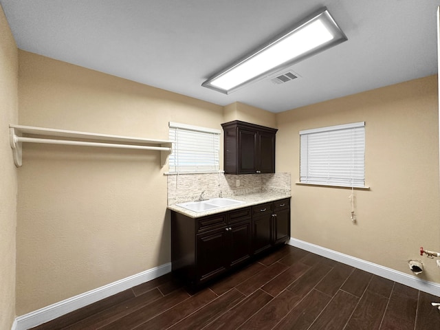 washroom with cabinets and sink