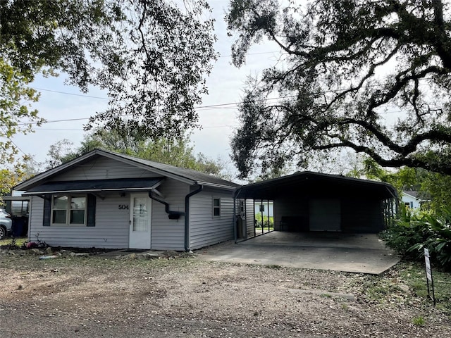 ranch-style home with a carport