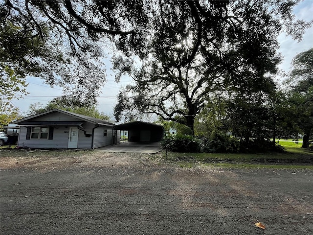 view of front of home featuring a carport