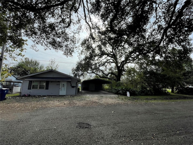 view of front of home featuring a carport