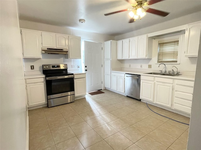 kitchen with appliances with stainless steel finishes, sink, and white cabinetry