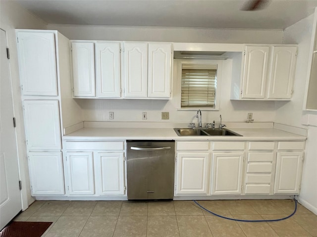 kitchen featuring stainless steel dishwasher, white cabinets, sink, and light tile patterned flooring