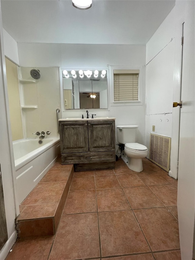 full bathroom featuring tub / shower combination, tile patterned floors, vanity, and toilet