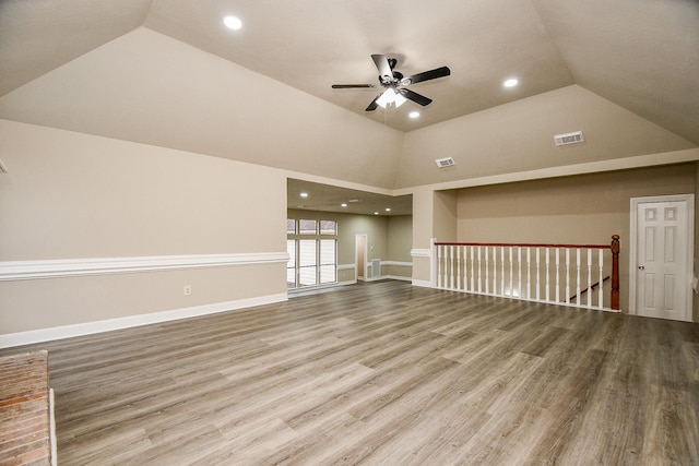 spare room featuring ceiling fan, wood-type flooring, and high vaulted ceiling