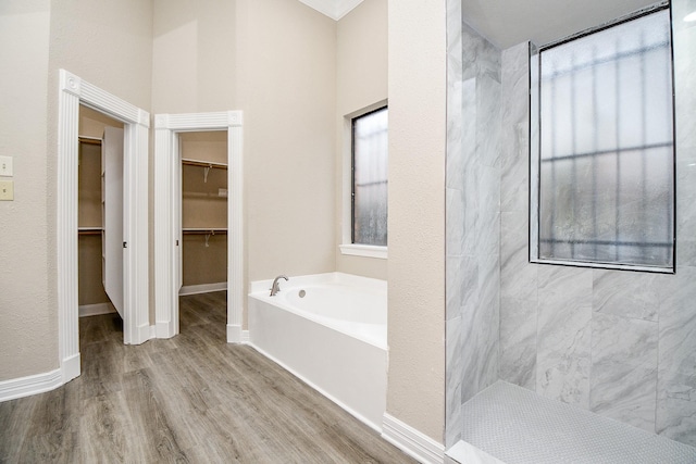 bathroom featuring a bathing tub and hardwood / wood-style flooring