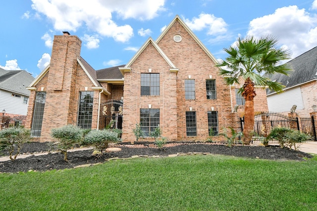 front facade featuring a front yard