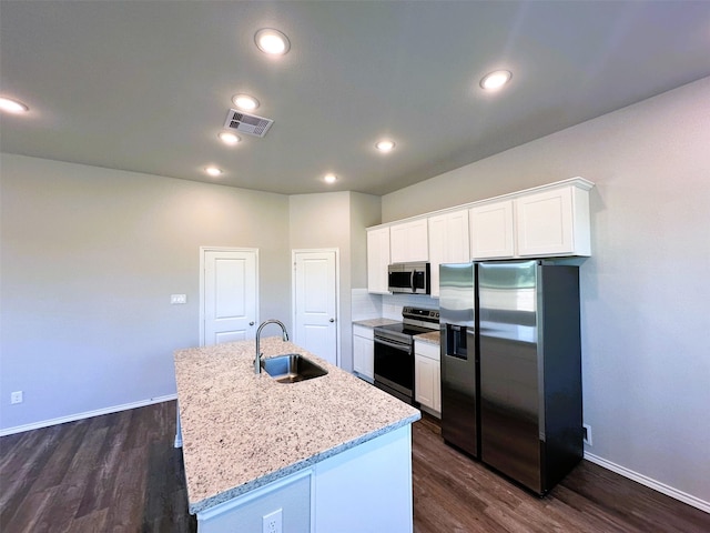 kitchen featuring stainless steel appliances, a kitchen island with sink, white cabinetry, and sink