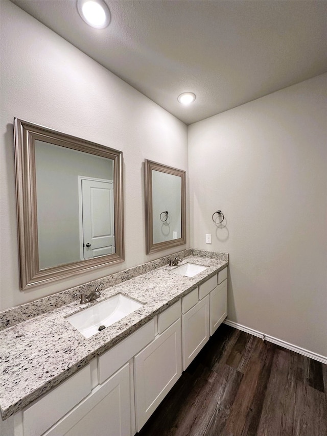 bathroom featuring wood-type flooring and vanity