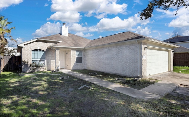 ranch-style house featuring a garage and a front yard