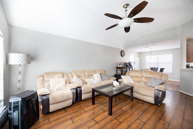 living room featuring ceiling fan, vaulted ceiling, and dark hardwood / wood-style floors