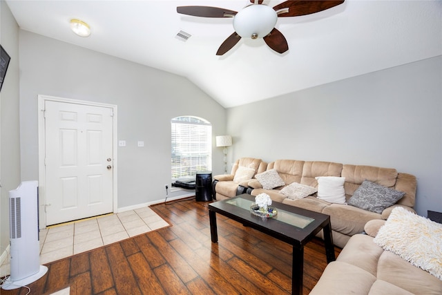 living room featuring ceiling fan, lofted ceiling, and hardwood / wood-style flooring