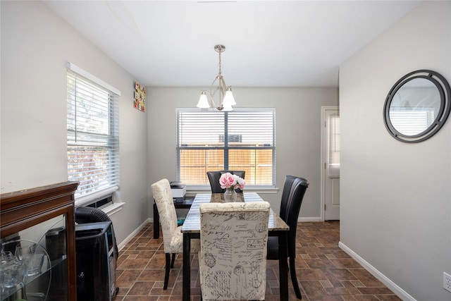 dining room with a wealth of natural light and an inviting chandelier