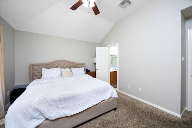 bedroom with ceiling fan, connected bathroom, lofted ceiling, and carpet flooring