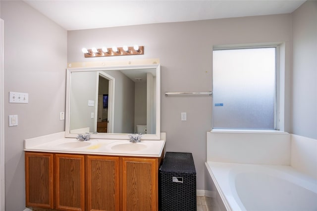 bathroom with vanity and a bathtub